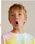 Boy model wearing a bright playful t-shirt.